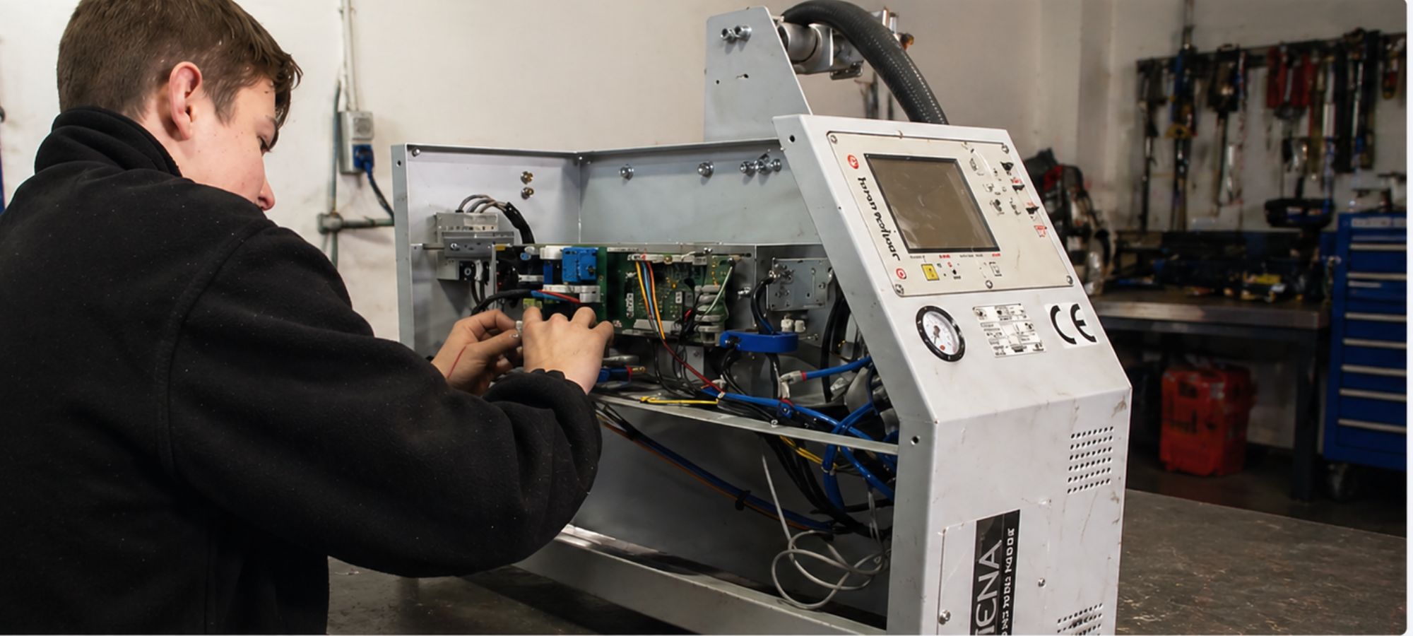 BWS Welding Engineer repairing a spot welder in a bodyshop
