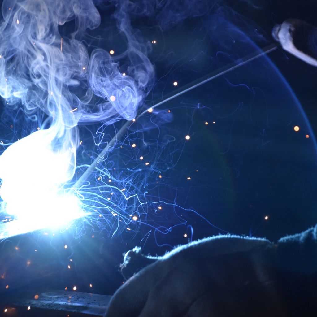 Arc welders welding some steel